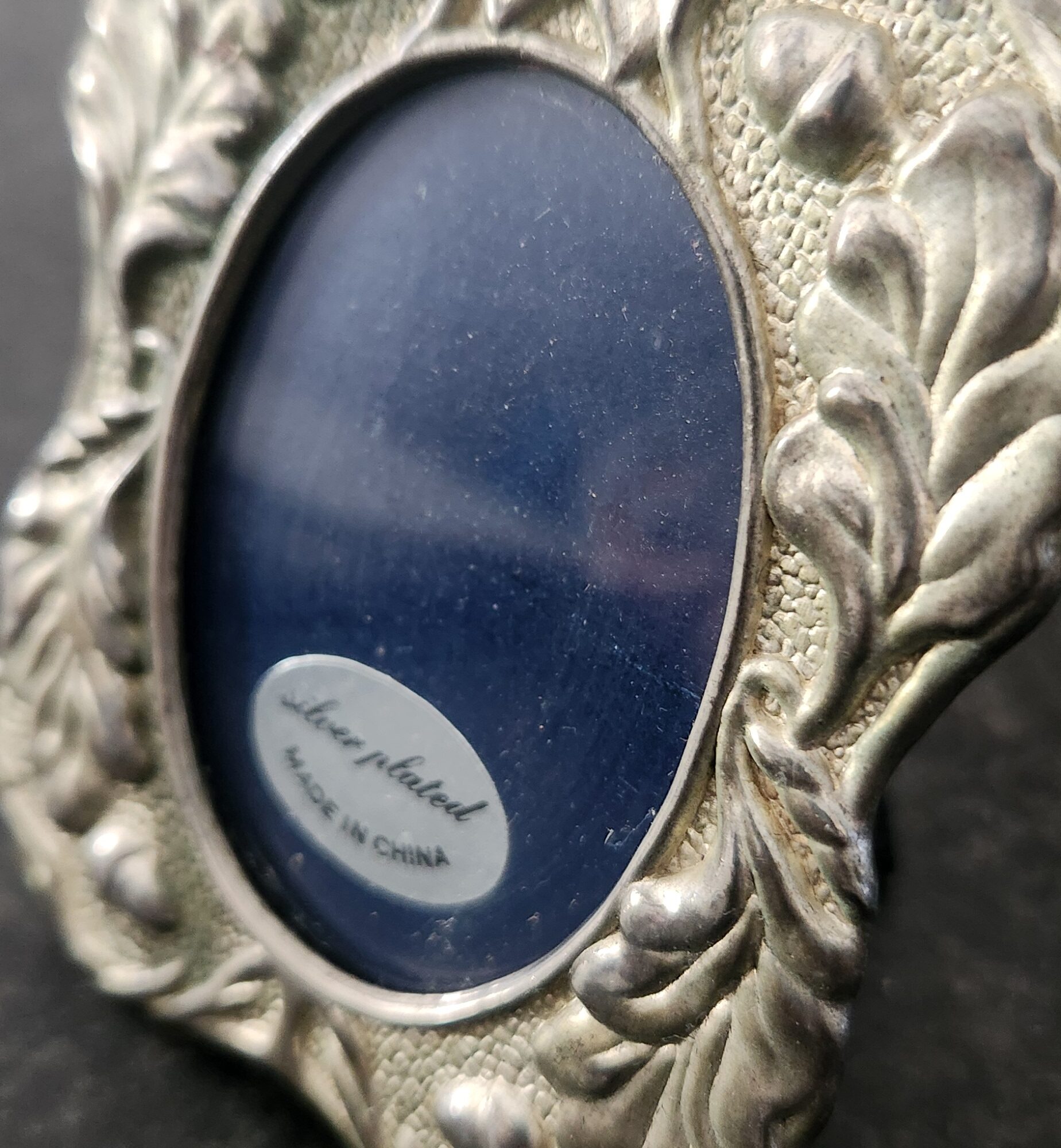 Acorn adorned silver plated frame with glass