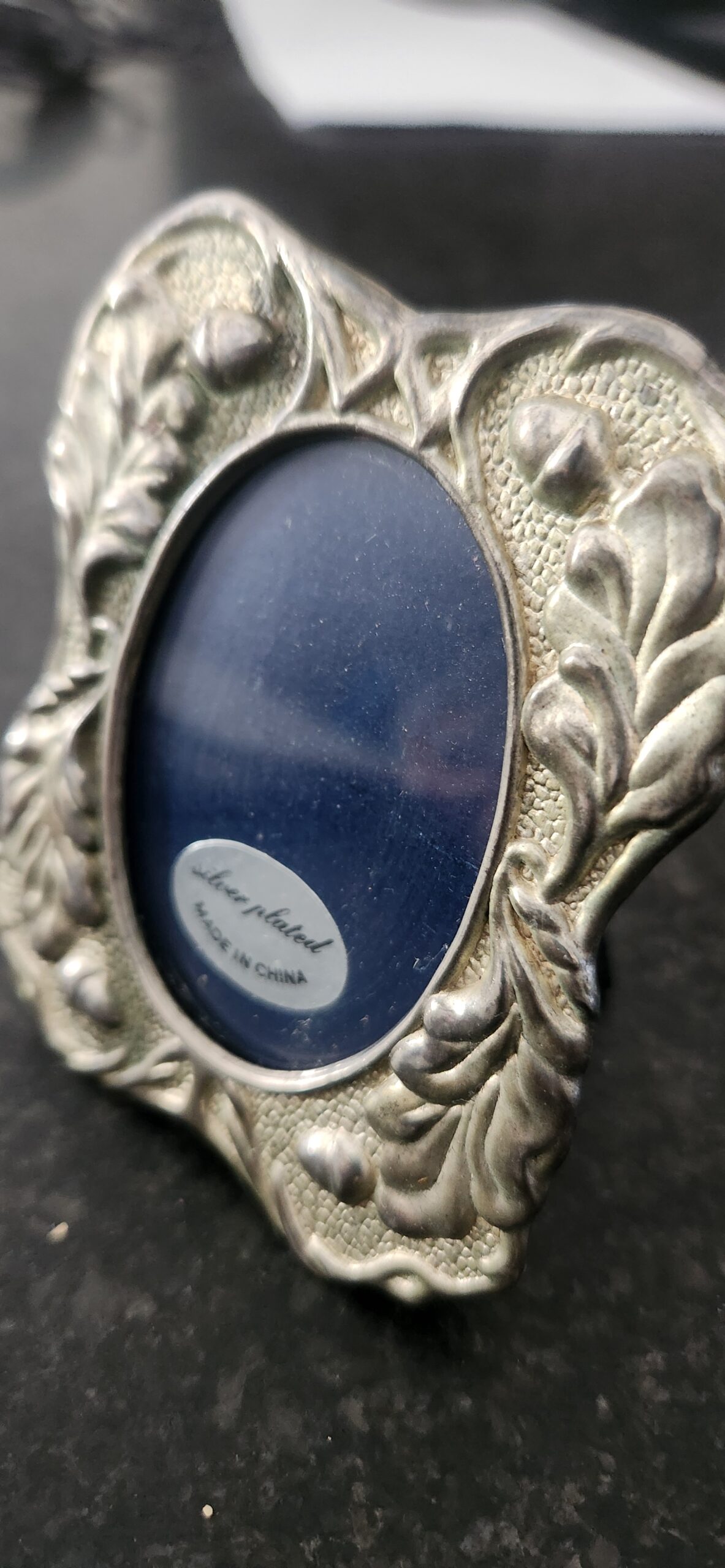 Acorn adorned silver plated frame with glass